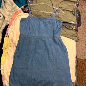 This is a mini Jean dress with pockets and zip up in the back